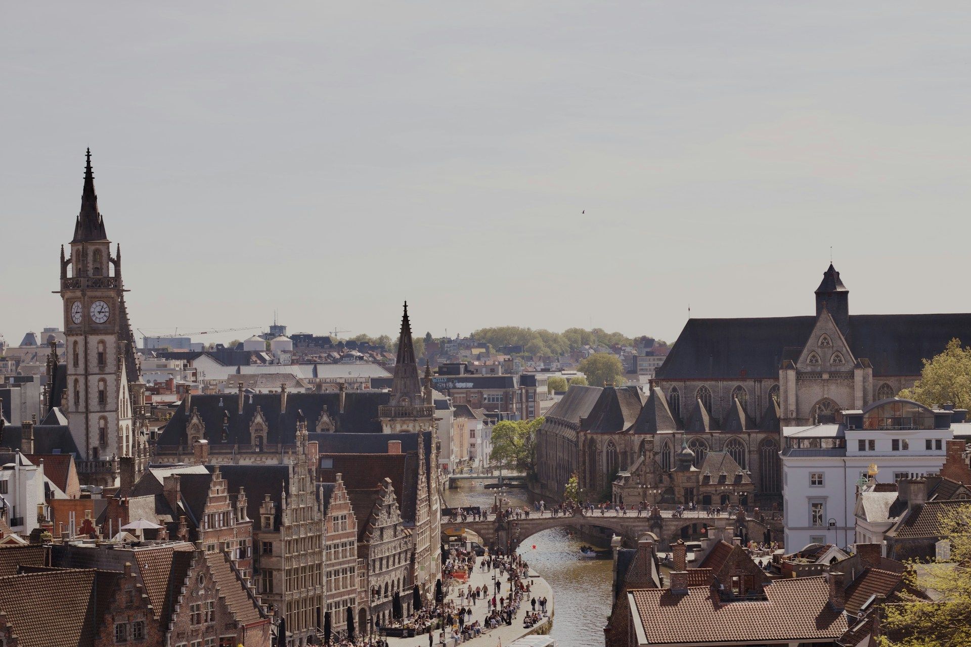 Aerial view of Ghent showing the historic city centre, towers and river.